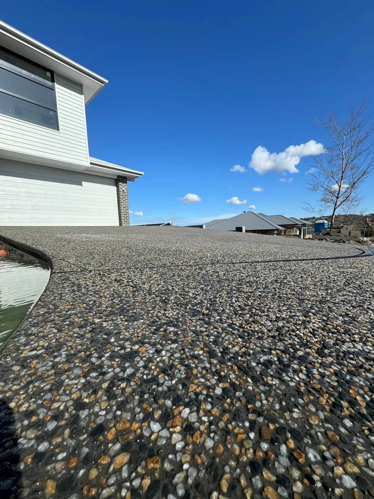 Close-up of a freshly finished exposed aggregate driveway